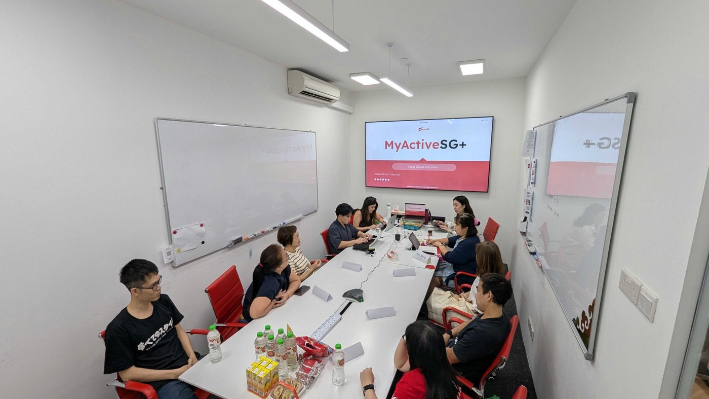 Photo: a focus group during the ActiveSG research, participants discussing the concept on screen.